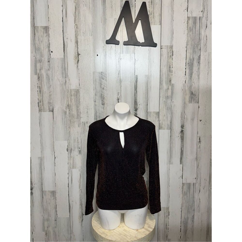 Jennifer Lopez metallic blouse